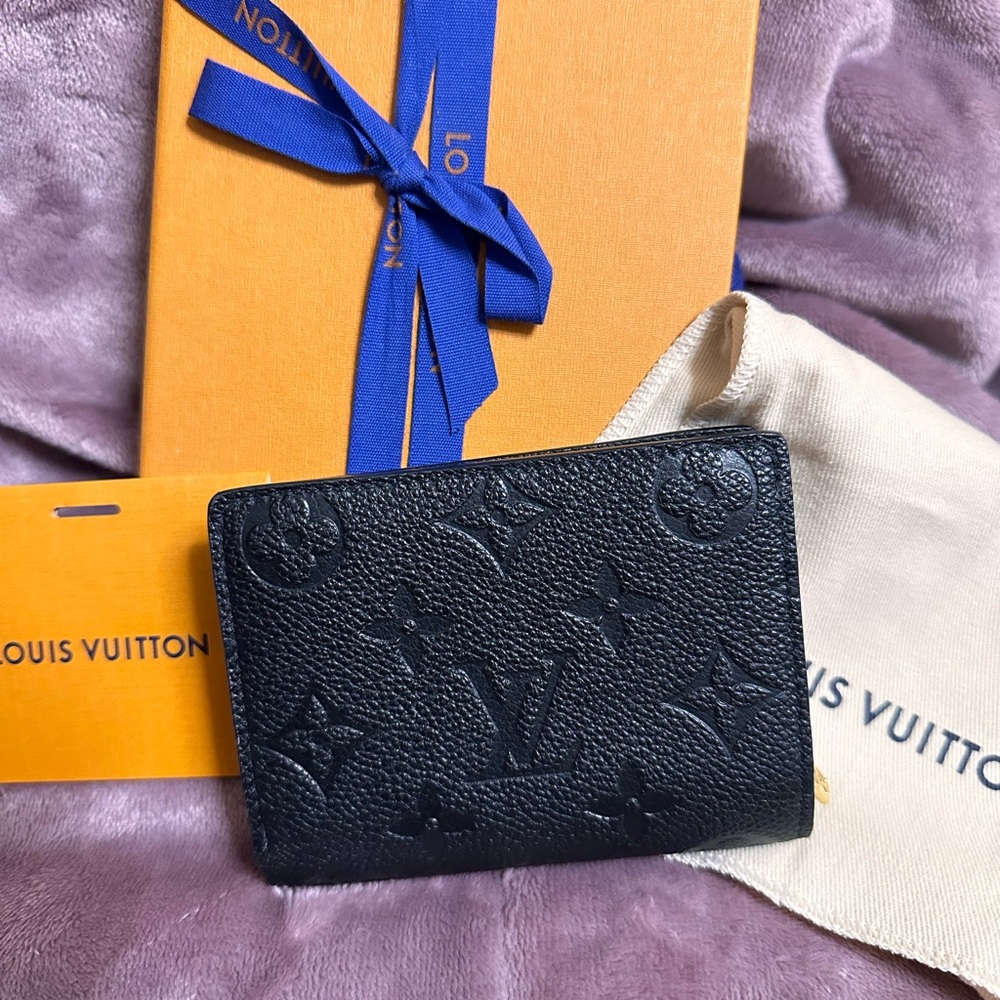 Louis Vuitton clea leather wallet